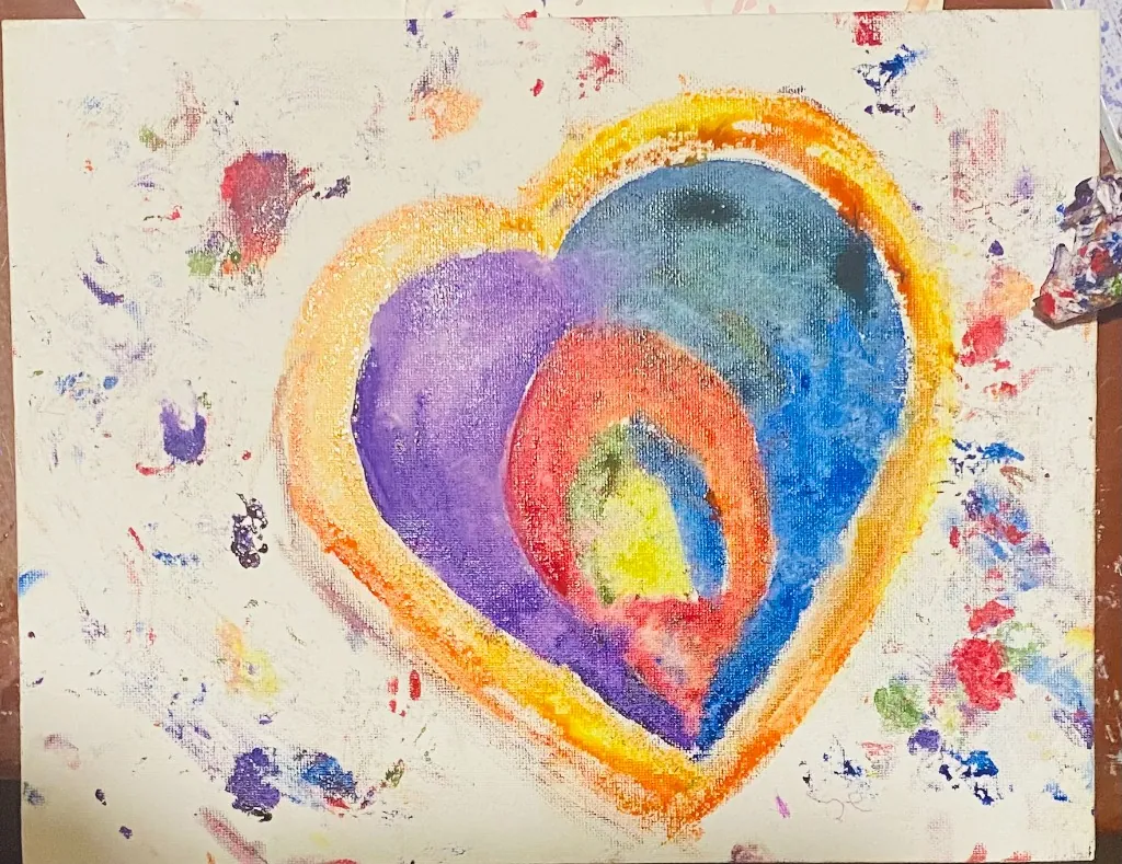 A colorful heart painting on canvas