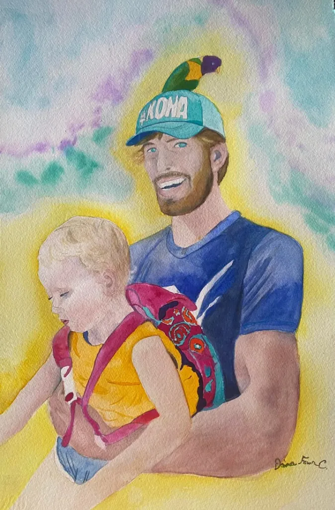 Man lovingly holding a sleeping child
