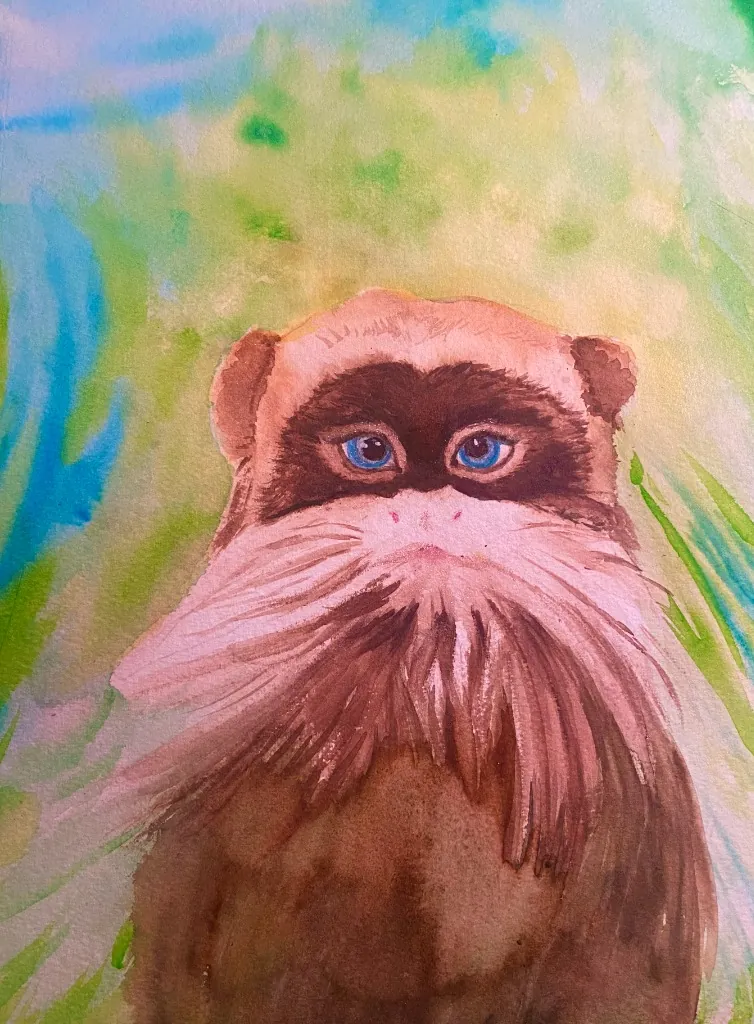 Portrait of a monkey or lemur in green foliage